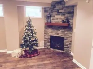 A young family of three that has just moved into their newly built home and has begun dreaming of what their Christmases could look like with a finished basement
